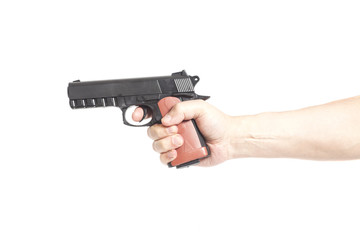 Hand with gun isolated