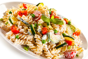 Fusilli pasta with white sauce and vegetables 