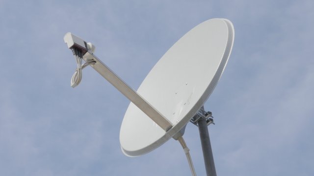 Aluminum made parabolic satellite dish antenna against blue sky 4K 2160p UltraHD footage - Satellite signal reception antenna with LNB converter 4K 3840X2160 UHD video 