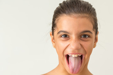 Young gril showing tongue