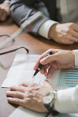 hands of the businessman with pen