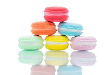 French colorful macarons stacks on white background