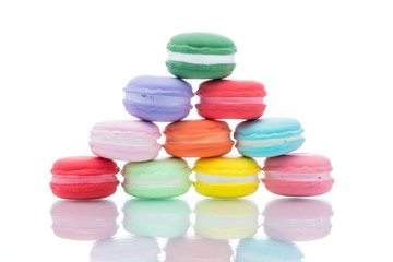 French colorful macarons stacks on white background