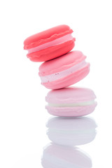 French colorful macarons stacks on white background