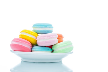 French colorful macarons stacks in dish