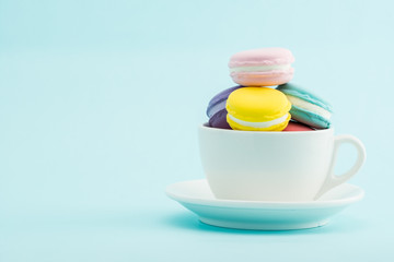 French colorful macarons stacks in cup, retro Styled