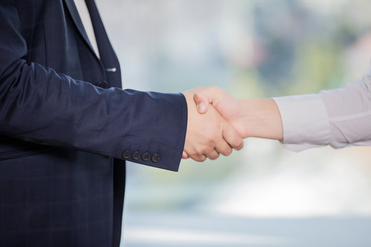 close-up of handshake of two businessmen in business suits