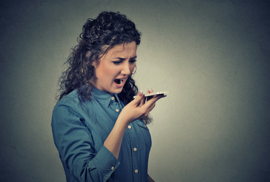ngry young woman screaming on mobile phone