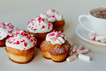 Beautiful coffee Cup with heart cupcake on white wooden background