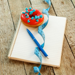 Colorful donuts and notepad