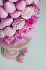 Fruit pyramid from fresh strawberry with pink roses