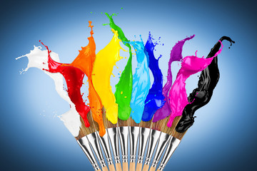 paintbrush row with colorful rainbow color splashes on blue background