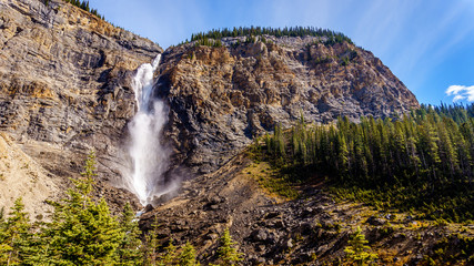 Takakkaw Falls in Yoho National Park in the Rocky Mountains. Plunging from above at a height of 380m (1246 ft ) with a 254m ( 833 ft ) free-fall, Canada's second highest waterfall