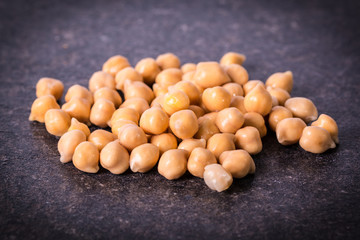 chickpeas on rustic background, healthy food concept