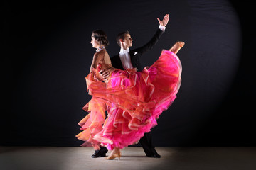dancers in ballroom isolated on black background