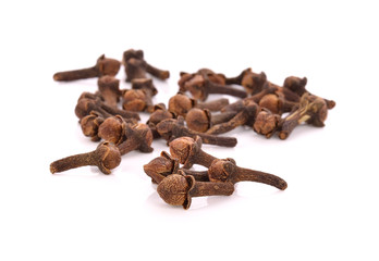 dry cloves on white background