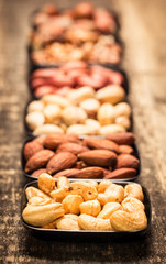 Mix nuts on wooden table,healthy vegan food.