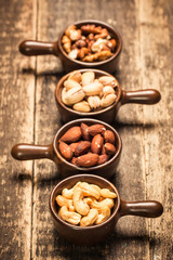 Mix nuts on wooden table,healthy vegan food.