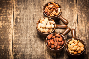 Mix nuts on wooden table,healthy vegan food.