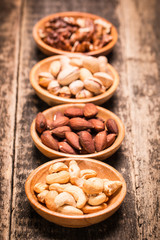 Mix nuts on wooden table,healthy vegan food.