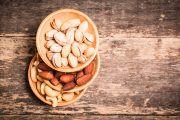 Mix nuts on wooden table,healthy vegan food.