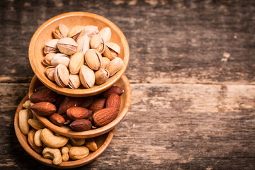 Mix nuts on wooden table,healthy vegan food.