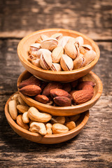 Mix nuts on wooden table,healthy vegan food.