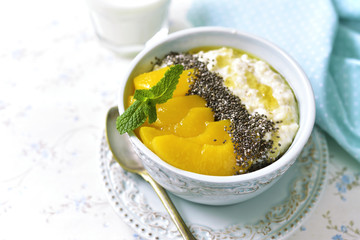 Oat porridge with chia seed,canned peaches and honey.