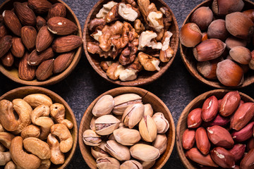 Obraz na płótnie Canvas Mix nuts on wooden table,healthy vegan food.