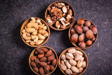 Mix nuts on wooden table,healthy vegan food.