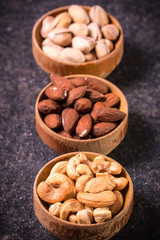 Mix nuts on wooden table,healthy vegan food.