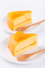 Orange cake and wood spoon