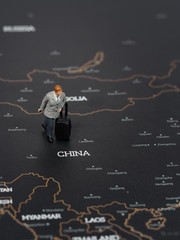 Miniature business man on map of China