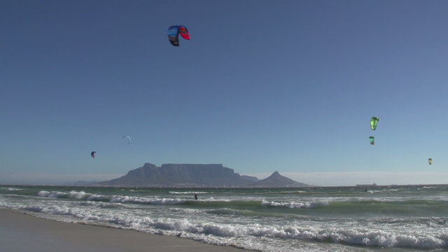 Windsurfers on the famous Bloubergstrand with Table Mountain in the background, Cape Town, South Africa