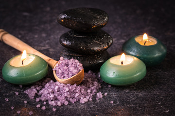 spa concept with stone and candles  on wooden table ,