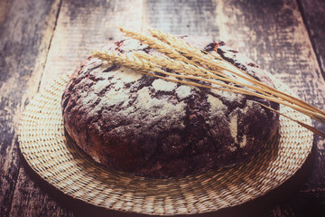 Fresh bread on wooden table ,vintage filter