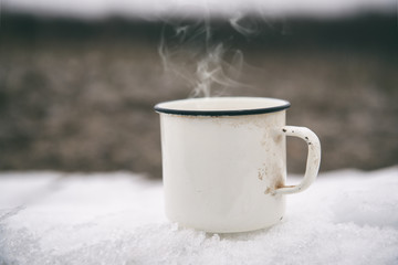Obraz na płótnie Canvas Hot drink on a cold snow