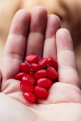 Handful of cinnamon hearts still life
