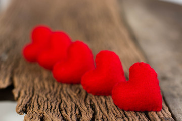 Fototapeta premium Valentines Day background with Red Hearts on old vintage wooden