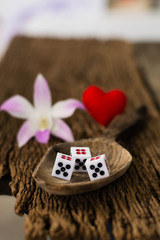 red heart,  dice and orchid as symbol of love, valentines