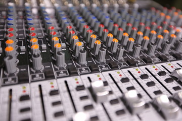 TV editor working with video and audio mixer