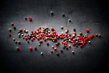 Peppercorns on a dark background