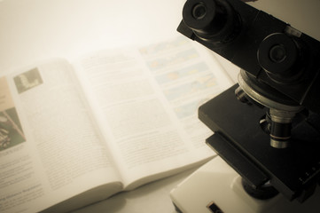 Microscope on table for vintage science background