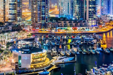 Dubai downtown night scene with city lights.