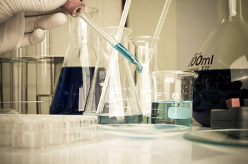 science laboratory test tubes with periodic table background