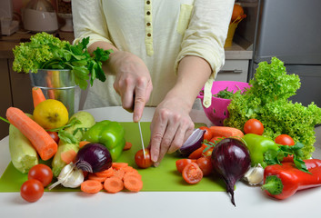 Woman Cutting Fresh Vegetables