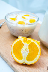 Breakfast, orange, eating cereal, pick up spoon, scoop cereal wi