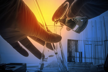 science laboratory test tubes with periodic table background