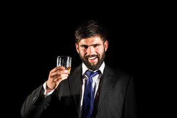 Man drinking a glass of whisky