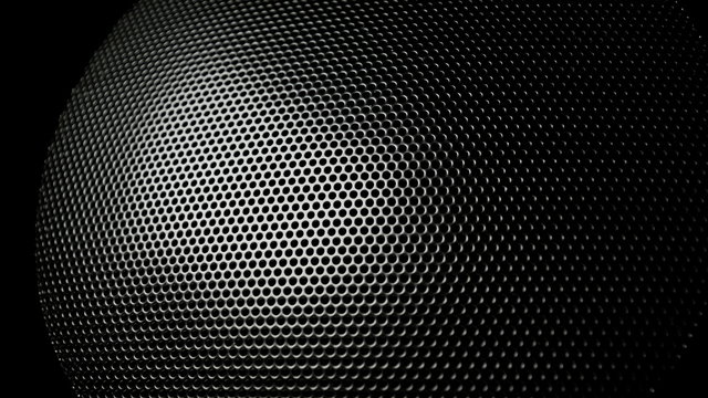 Dark metal background with perforated holes. 4K 3840x2160 UHD video.
